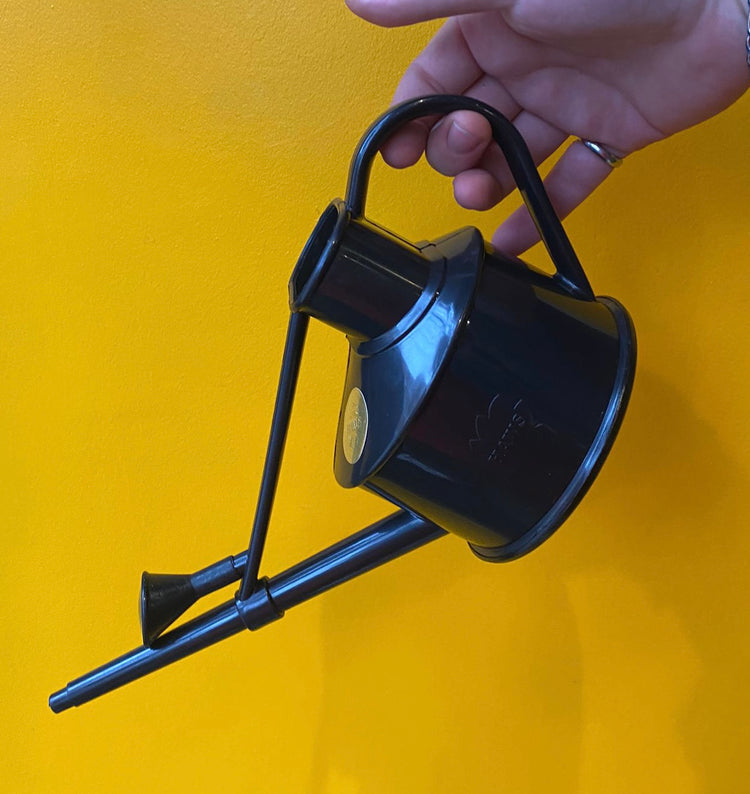 Haws - Langley Sprinker Watering Can in Recycled in front of a yellow background