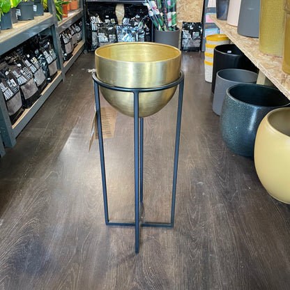 A NKUKU Brass Planter Stand in Urban Tropicana’s store in Chiswick, London.